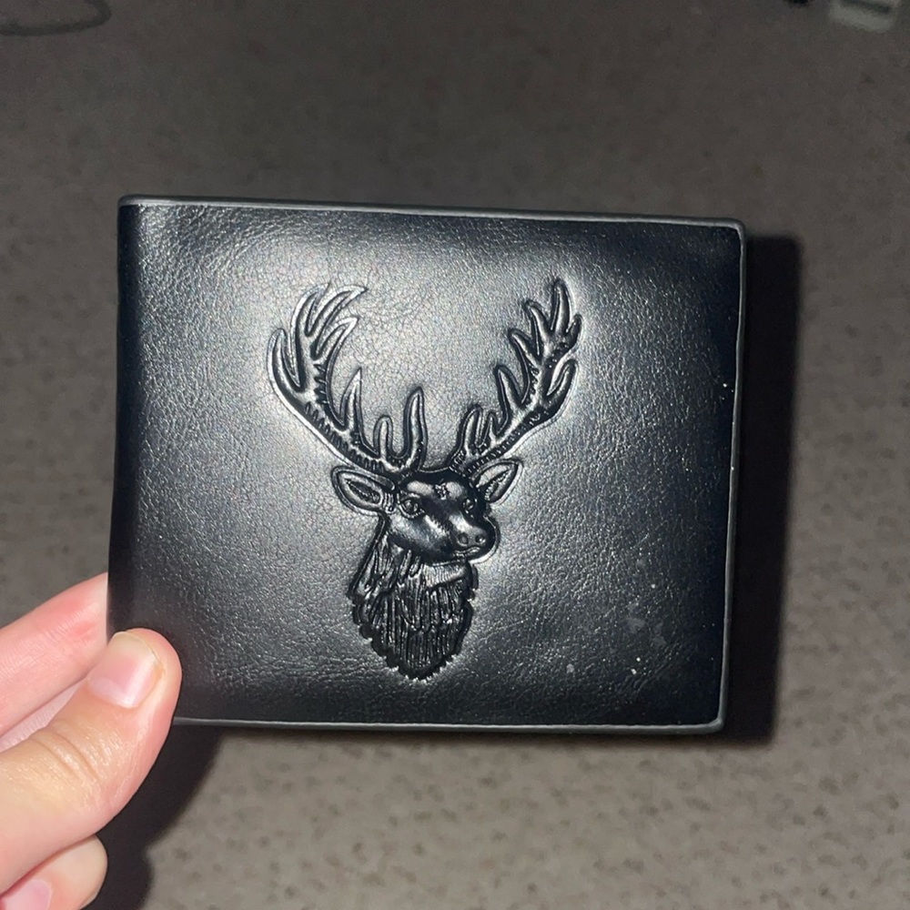 Leathered wallet deer cover